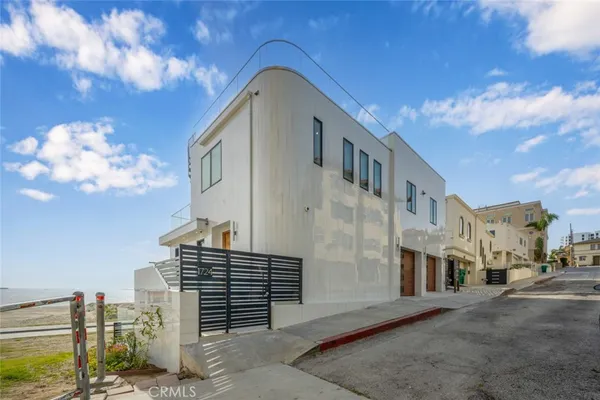 a view of a blue building with many windows