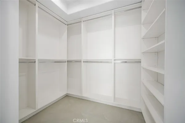 a view of bathroom with a sink and mirror
