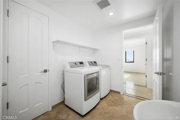 a view of a livingroom with a flat screen tv and furniture