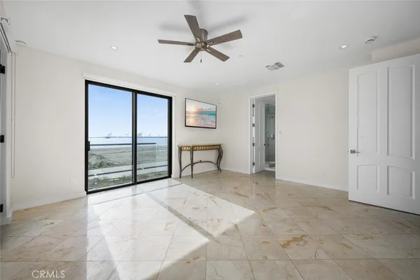 a spacious bathroom with double sink and a mirror