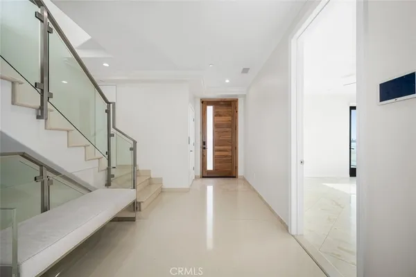 a view of a hallway with staircase