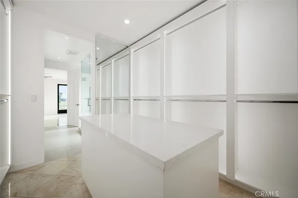 a spacious bedroom with a bed and a couch