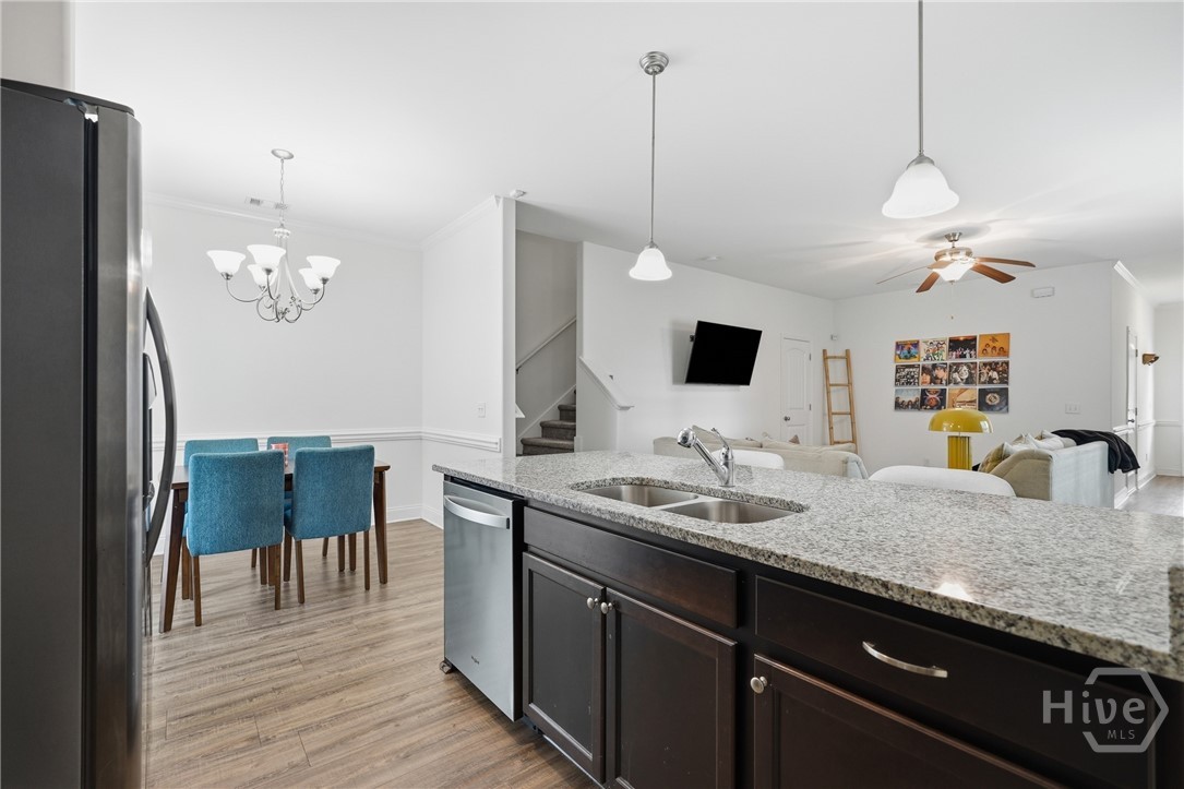 11330 White Bluff Road, Unit 31 Savannah, GA 31419 - Photo 13 of 36 Open views into the living room from the kitchen.