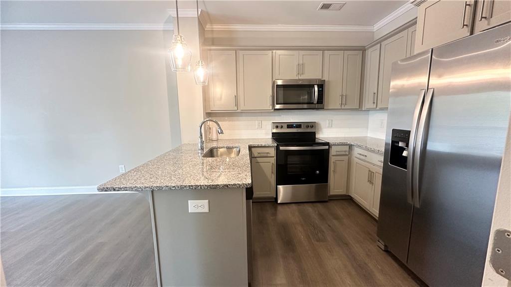 3092 Quantum Lane Atlanta, GA 30341 - Photo 13 of 44 a kitchen with stainless steel appliances granite countertop a refrigerator a stove a sink and a microwave