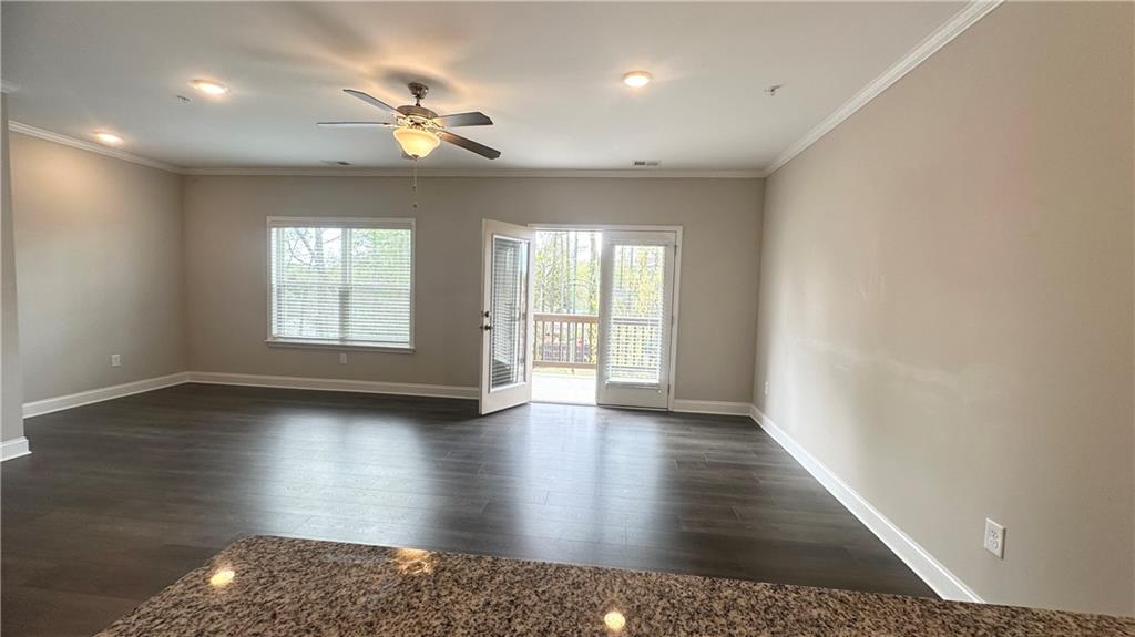 3092 Quantum Lane Atlanta, GA 30341 - Photo 23 of 44 an empty room with wooden floor and windows