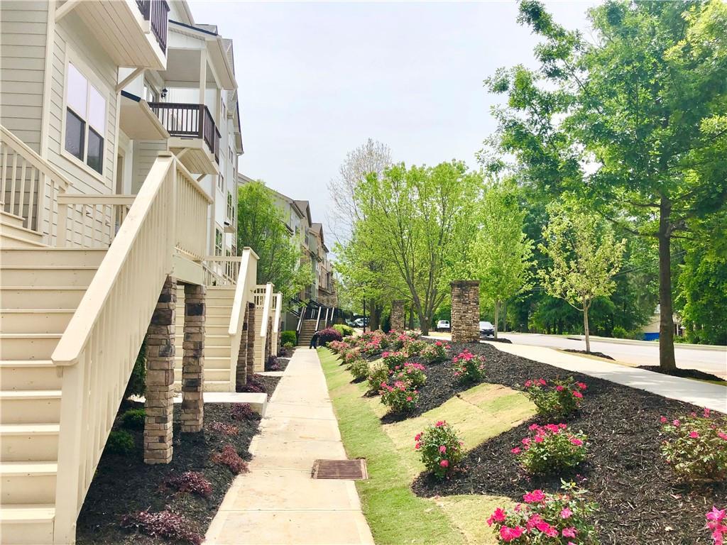 3092 Quantum Lane Atlanta, GA 30341 - Photo 3 of 44 a view of a pathway of a house with a yard