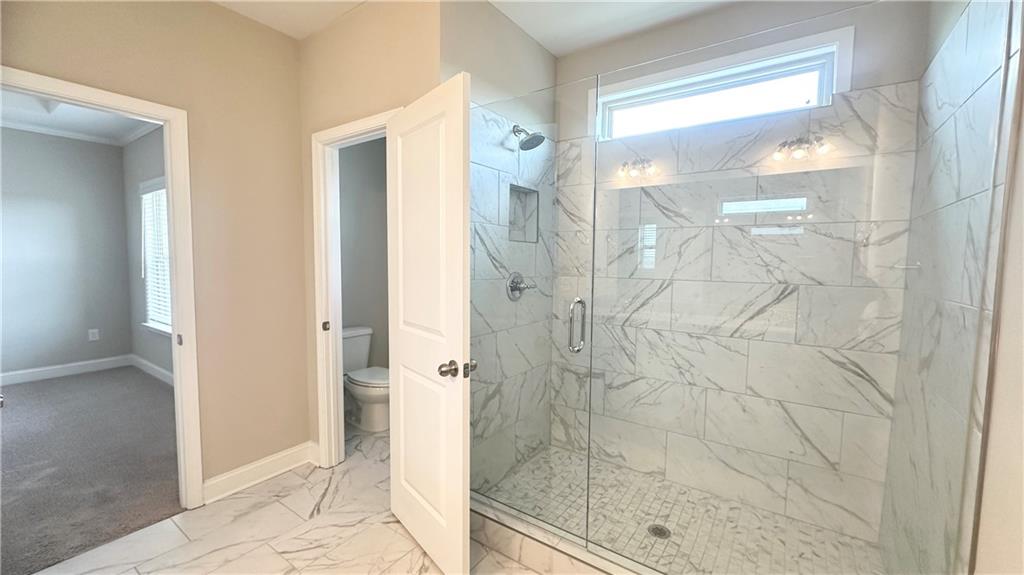 3092 Quantum Lane Atlanta, GA 30341 - Photo 33 of 44 a bathroom with a glass shower door