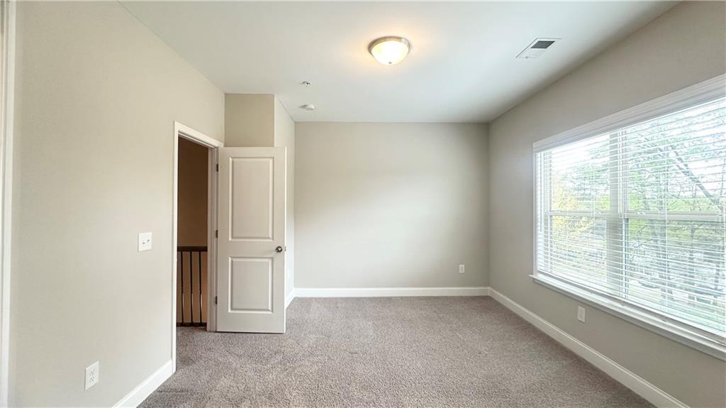 3092 Quantum Lane Atlanta, GA 30341 - Photo 36 of 44 an empty room with windows and closet