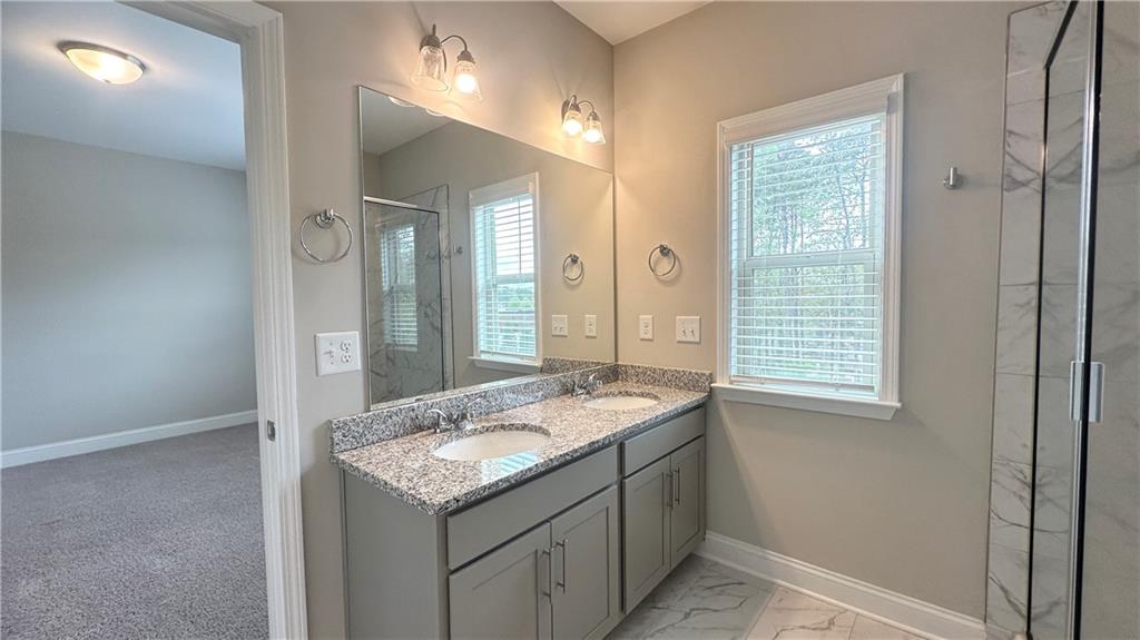 3092 Quantum Lane Atlanta, GA 30341 - Photo 38 of 44 a bathroom with a granite countertop sink and a mirror