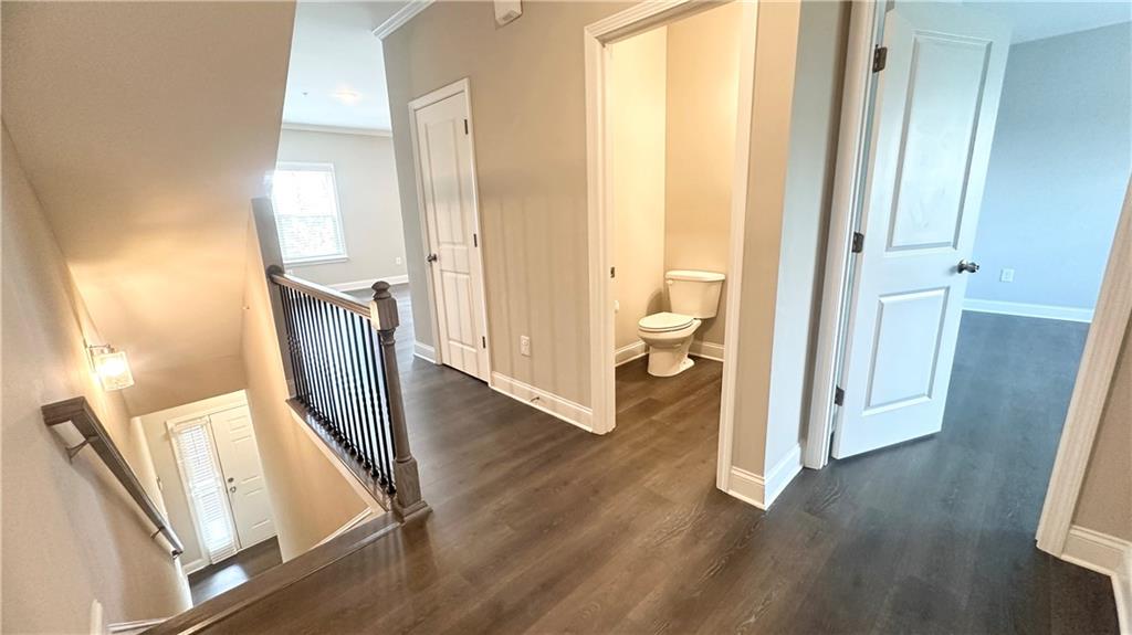 3092 Quantum Lane Atlanta, GA 30341 - Photo 8 of 44 a view of a hallway with wooden floor and staircase