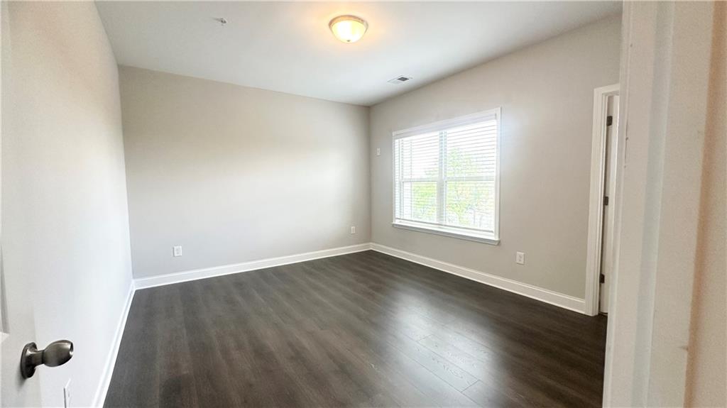 3092 Quantum Lane Atlanta, GA 30341 - Photo 9 of 44 an empty room with wooden floor and windows