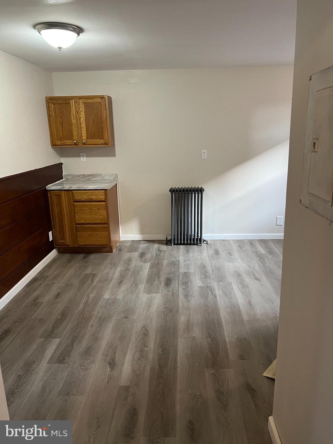105 Atlantic Street, Unit F1 Bridgeton, NJ 08302 - Photo 7 of 9 a view of empty room with wooden floor