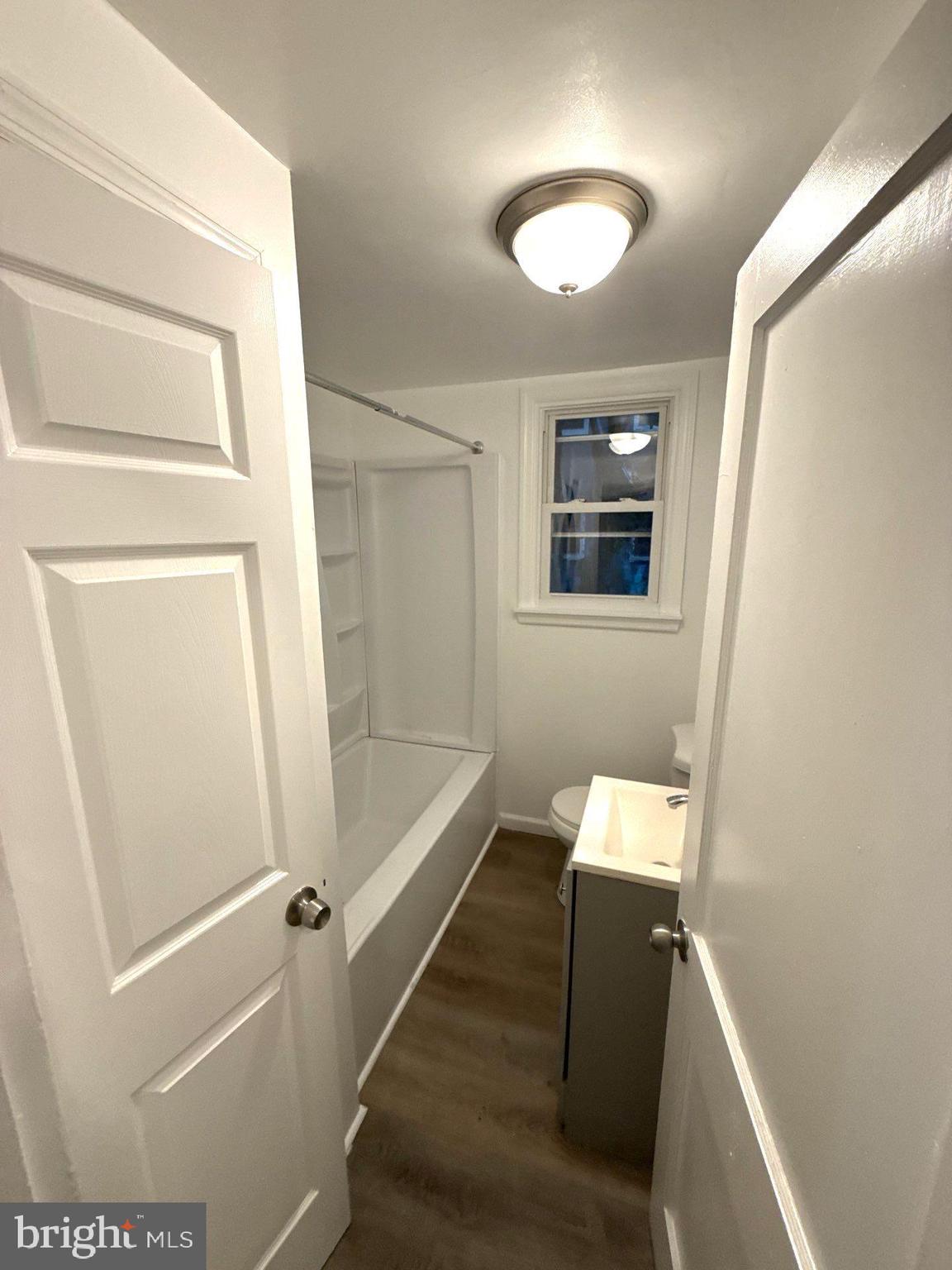 105 Atlantic Street, Unit F1 Bridgeton, NJ 08302 - Photo 8 of 9 a bathroom with a tub and shower