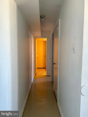 a view of a bathroom from a hallway