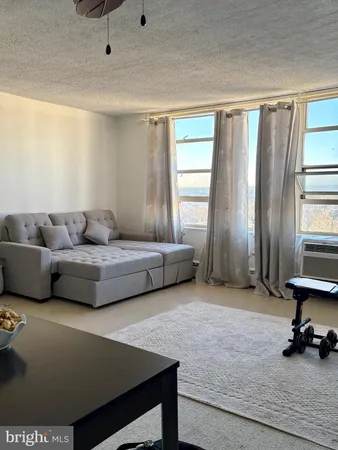 a living room with furniture and a window