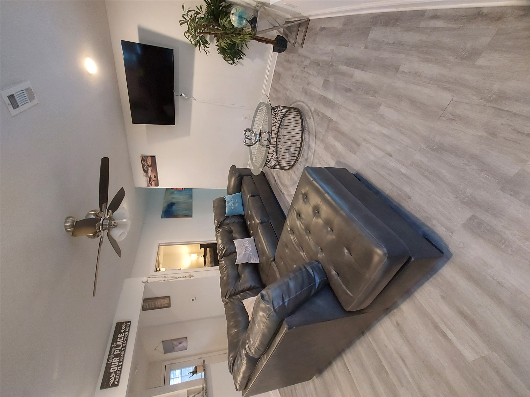 20202 McShepherd Road Georgetown, TX 78626 - Photo 13 of 40 Living area featuring light wood-style flooring and ceiling fan