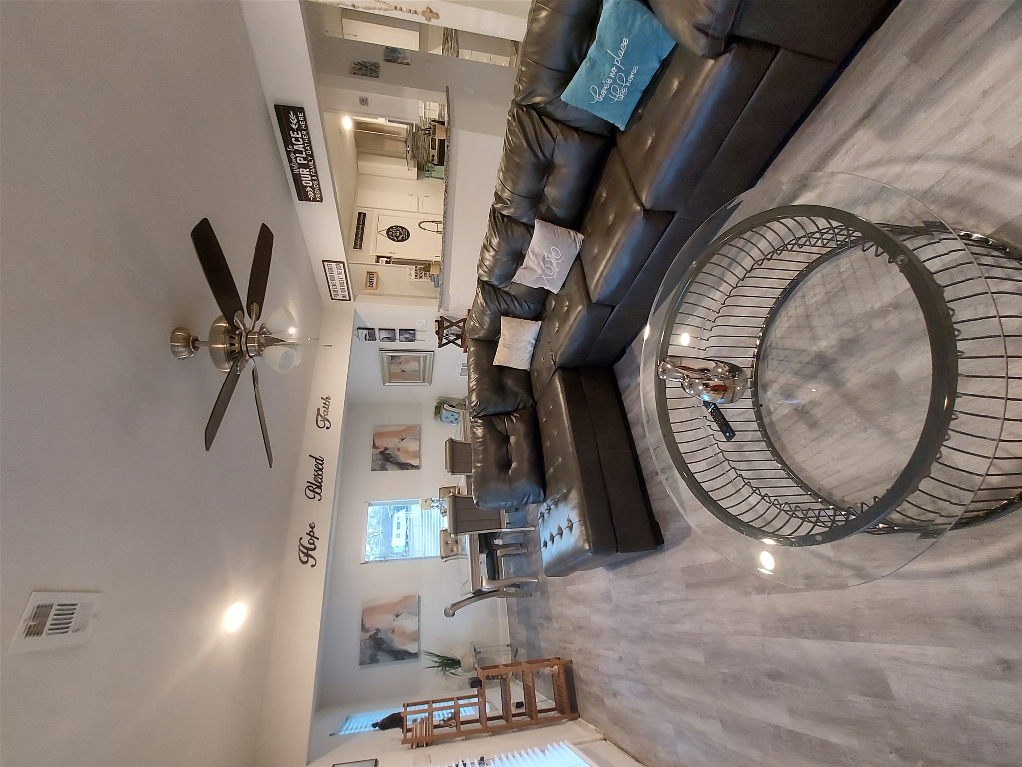 20202 McShepherd Road Georgetown, TX 78626 - Photo 14 of 40 Living area with a ceiling fan and wood finished floors