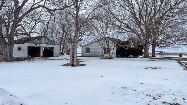 a view of a yard covered with snow