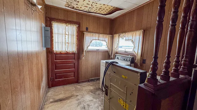 a view of a room with furniture and a window