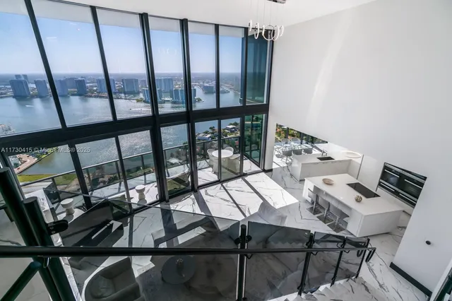 a view of a dining room with furniture and window