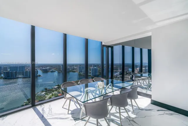 a view of a patio with a table and chairs