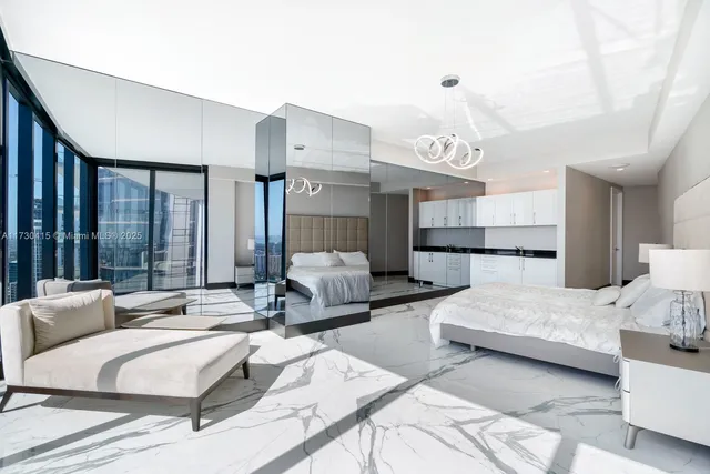 a bathroom with a bathtub a double vanity sink and mirror