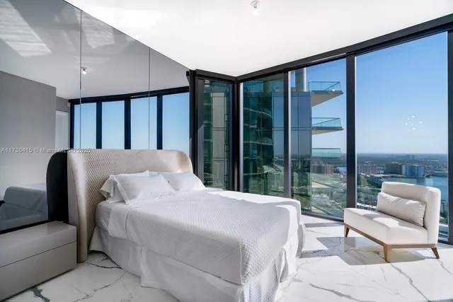 a room with lots of furniture and windows