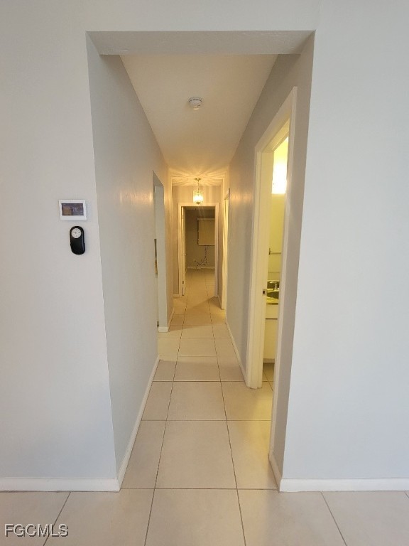 45 Tangelo Court Lehigh Acres, FL 33936 - Photo 5 of 19 a view of a hallway with wooden shelves
