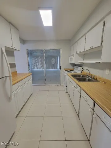 a kitchen with a cabinets and appliances