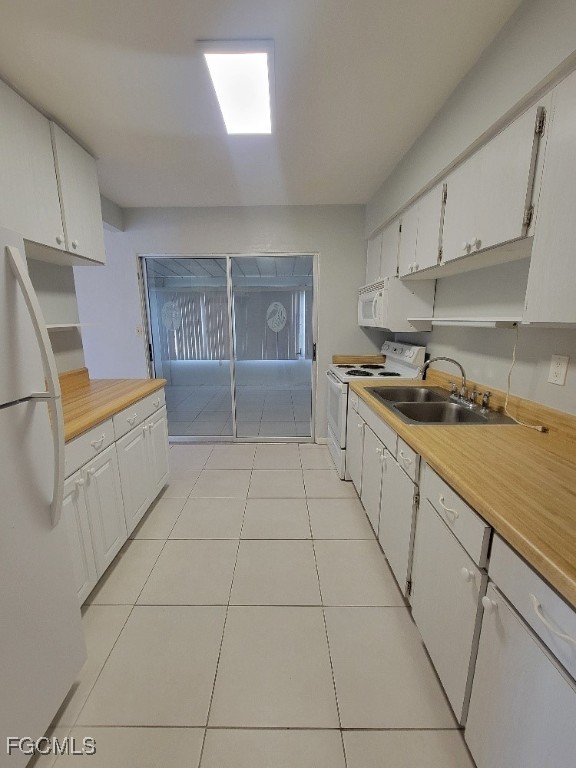 45 Tangelo Court Lehigh Acres, FL 33936 - Photo 6 of 19 a kitchen with a cabinets and appliances