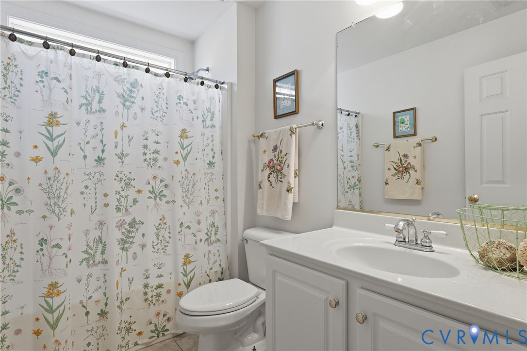 13424 Tipple Point Road Midlothian, VA 23114 - Photo 40 of 53 a bathroom with a sink toilet and shower
