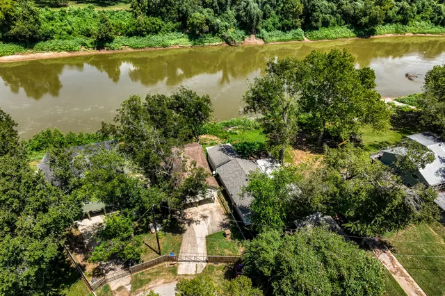 a view of a lake with a yard and mountain
