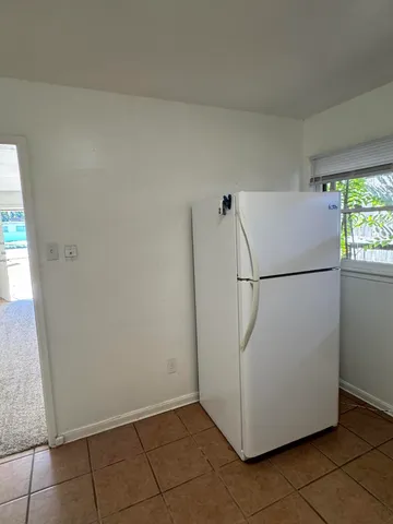 a utility room with cabinets