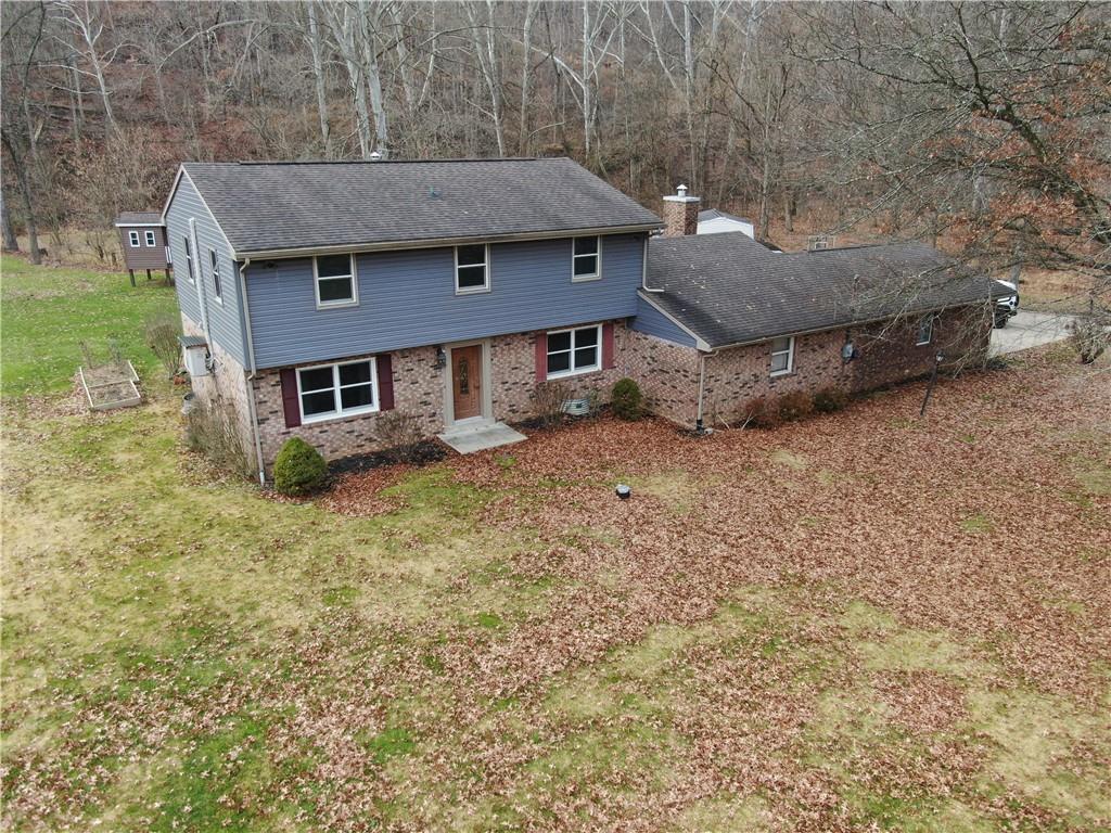 808 Lone Pine Road Amity, PA 15311 - Photo 1 of 38 an aerial view of a house with a yard and large tree