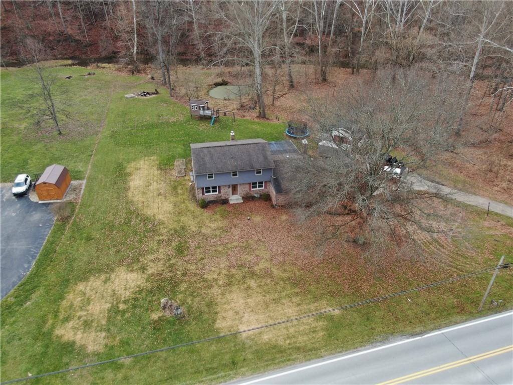 808 Lone Pine Road Amity, PA 15311 - Photo 11 of 38 a backyard of a house with table and chairs