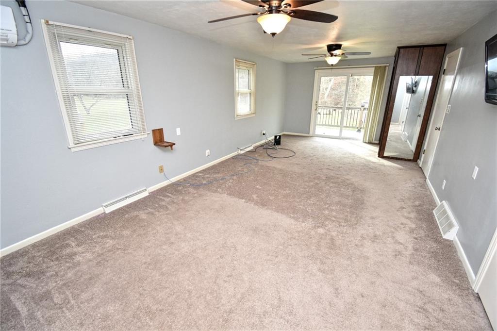 808 Lone Pine Road Amity, PA 15311 - Photo 28 of 38 an empty room with windows and fan