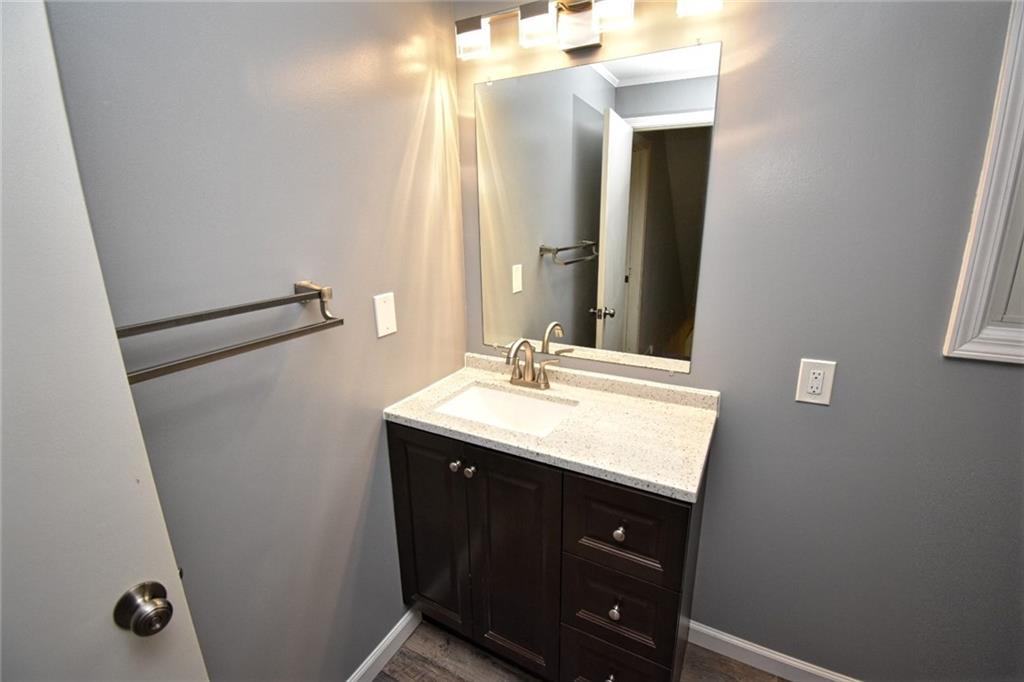 808 Lone Pine Road Amity, PA 15311 - Photo 32 of 38 a bathroom with a sink vanity and a mirror