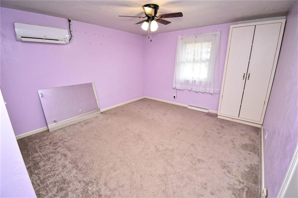 808 Lone Pine Road Amity, PA 15311 - Photo 36 of 38 en empty room with windows and ceiling fan