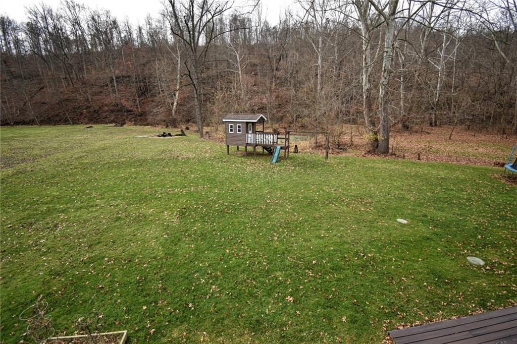 808 Lone Pine Road Amity, PA 15311 - Photo 6 of 38 a view of a chair and table on the backyard