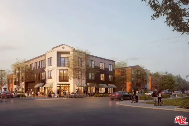 a city street lined with buildings and cars