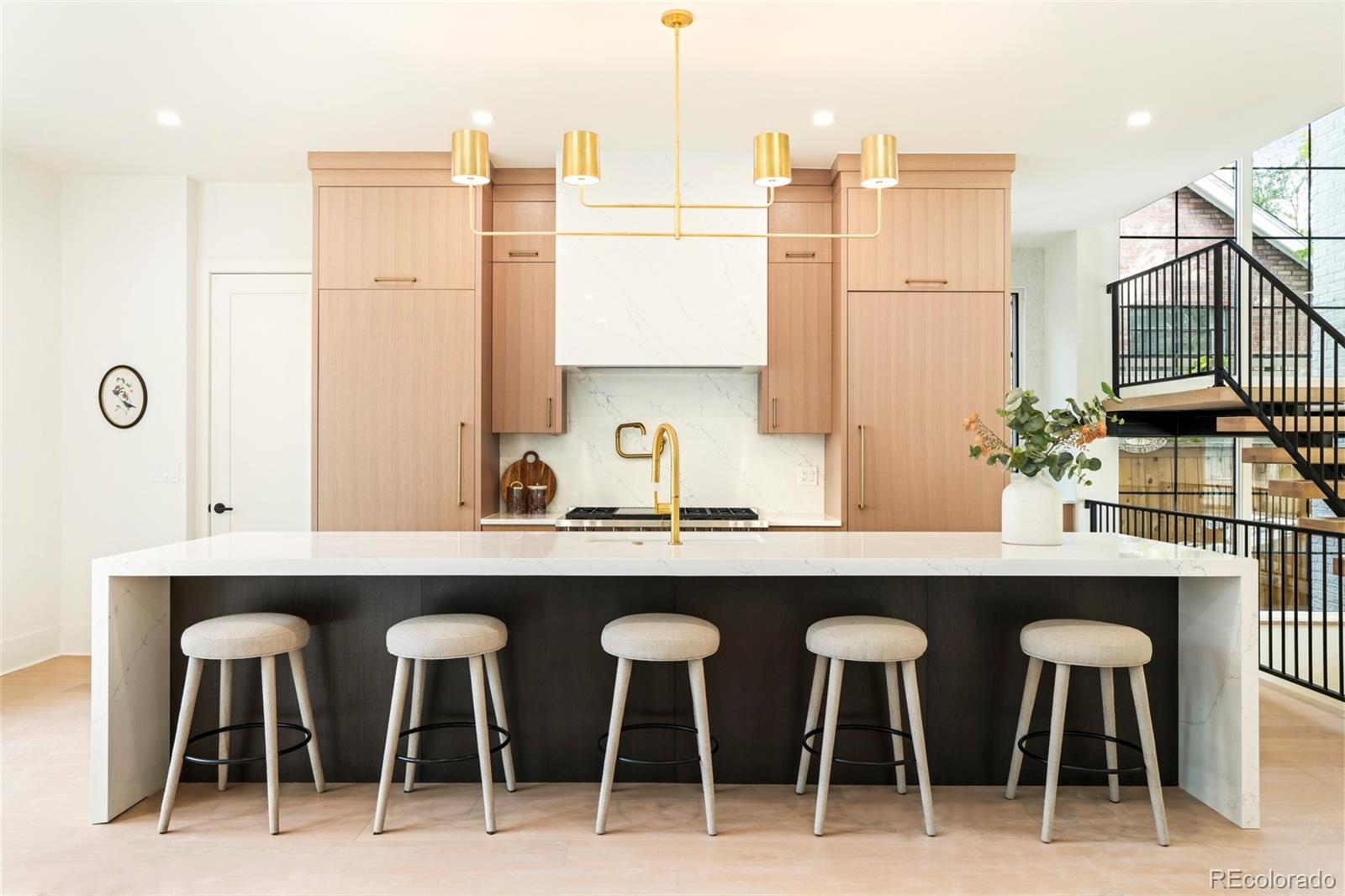 547 South Williams Street Denver, CO 80209 - Photo 13 of 50 a kitchen with a table chairs sink and cabinets