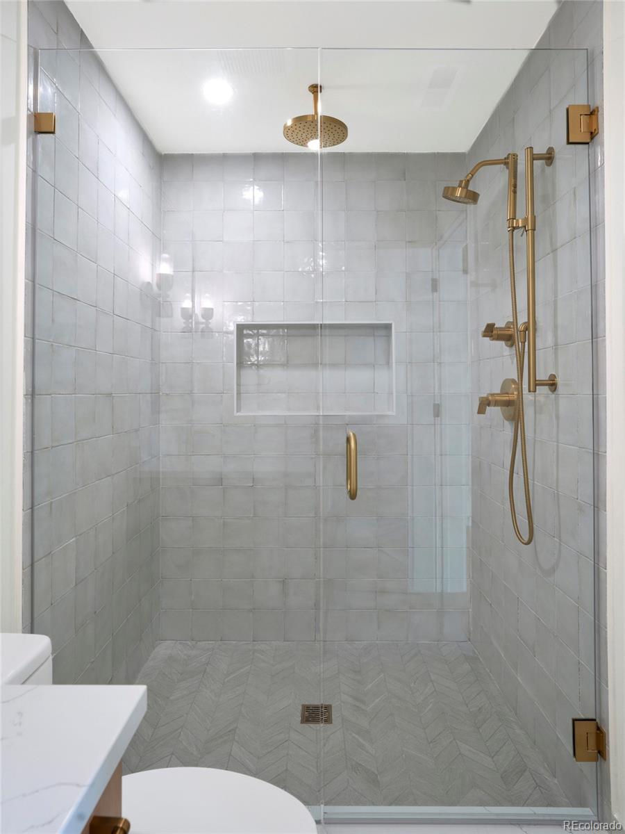 547 South Williams Street Denver, CO 80209 - Photo 21 of 50 a bathroom with a shower a toilet and sink