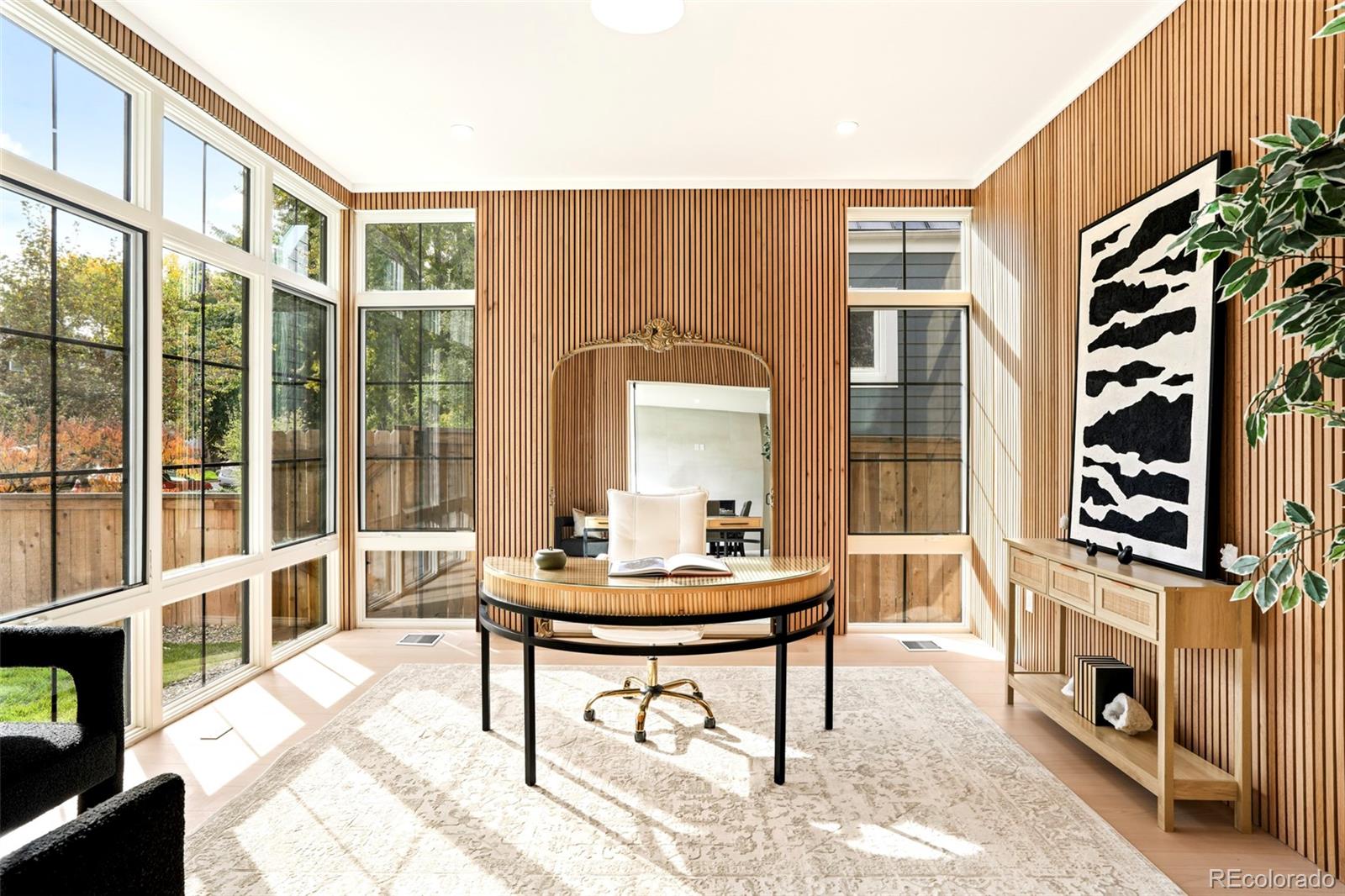 547 South Williams Street Denver, CO 80209 - Photo 4 of 50 a living room with furniture a fireplace and a large window