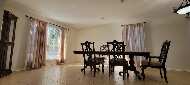 a view of a room with furniture and wooden floor