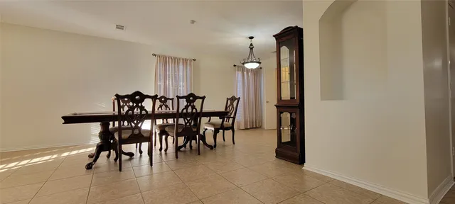 a view of a dining room with furniture