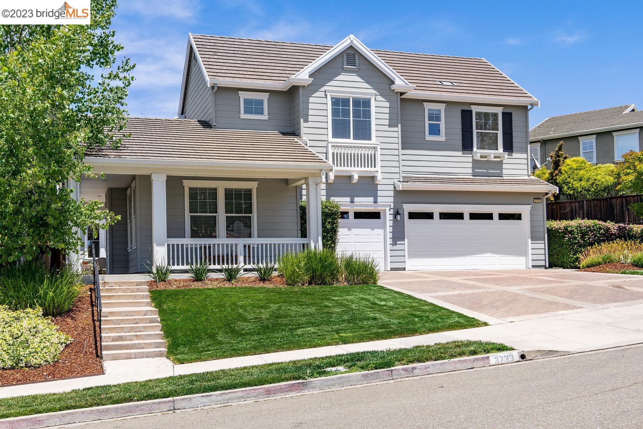 3733 Stonehenge Way San Ramon, CA 94582 - Photo 1 of 1 a front view of a house with a yard and garage