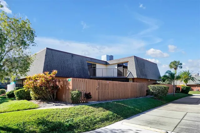 a view of a patio with a table and chairs