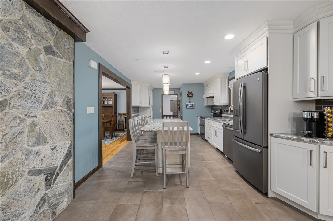 365 West Wrentham Road Cumberland, RI 02864 - Photo 10 of 50 Long view of kitchen shows opening to dining room.