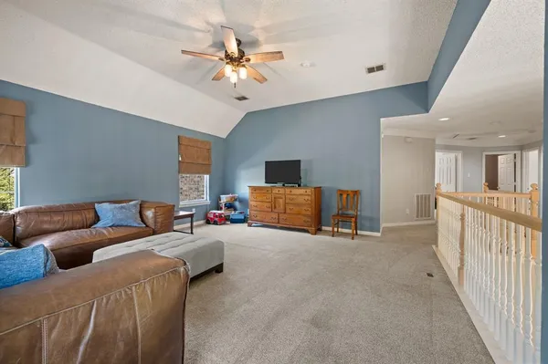 a spacious bathroom with a granite countertop sink mirror and a