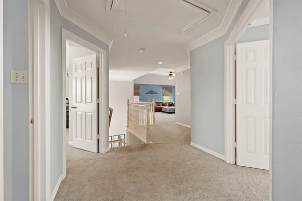 a view of a patio with table and chairs and potted plants